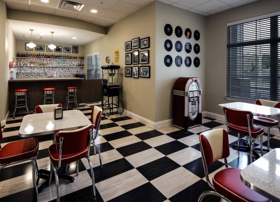 A retro-themed dining area with booths and decor