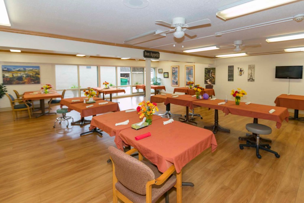 Bright dining area with tables set for meals