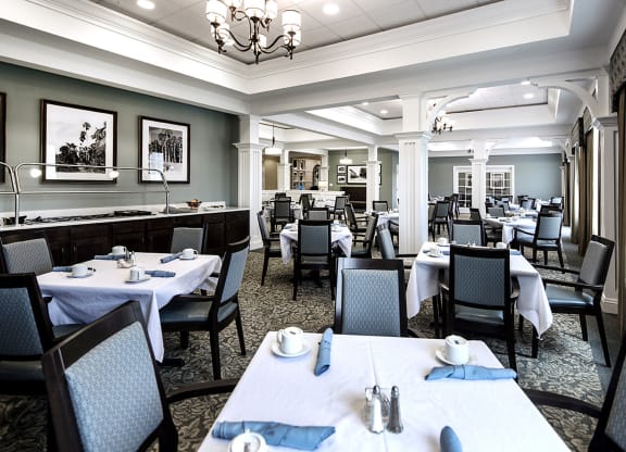 Bright dining room with tables set for meals