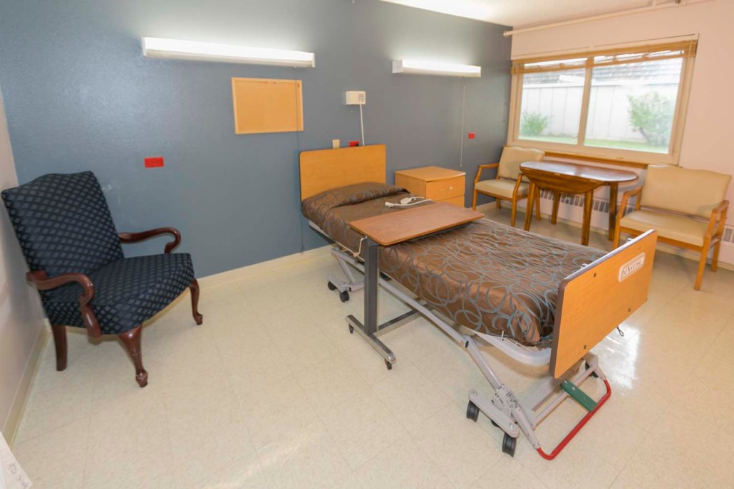 Senior resident room with bed and furniture