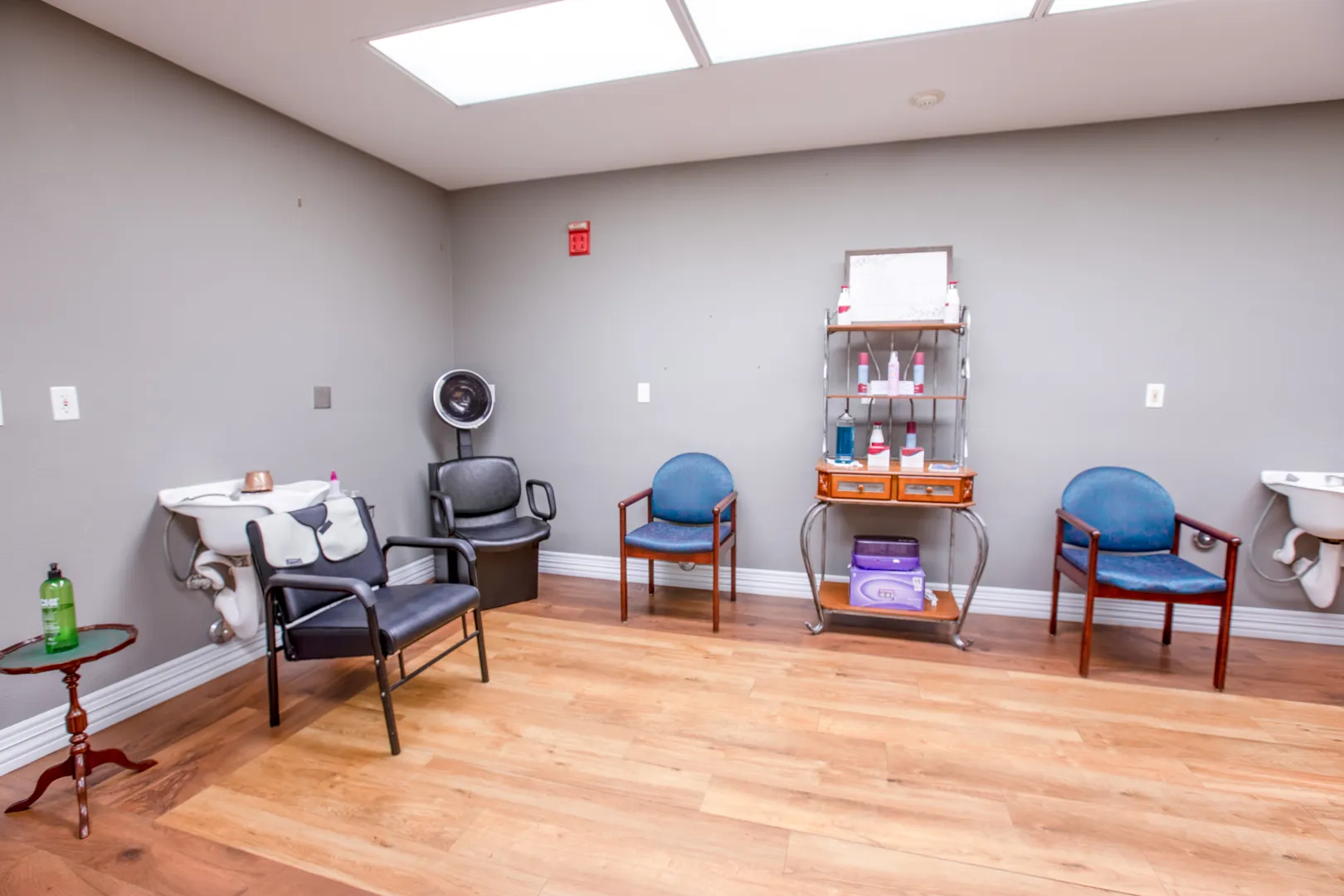 Interior view of a salon area with chairs and equipment