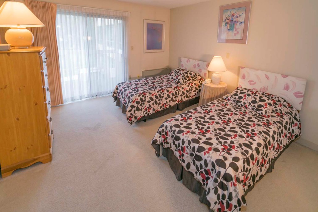 Bright interior of a shared resident room with two beds