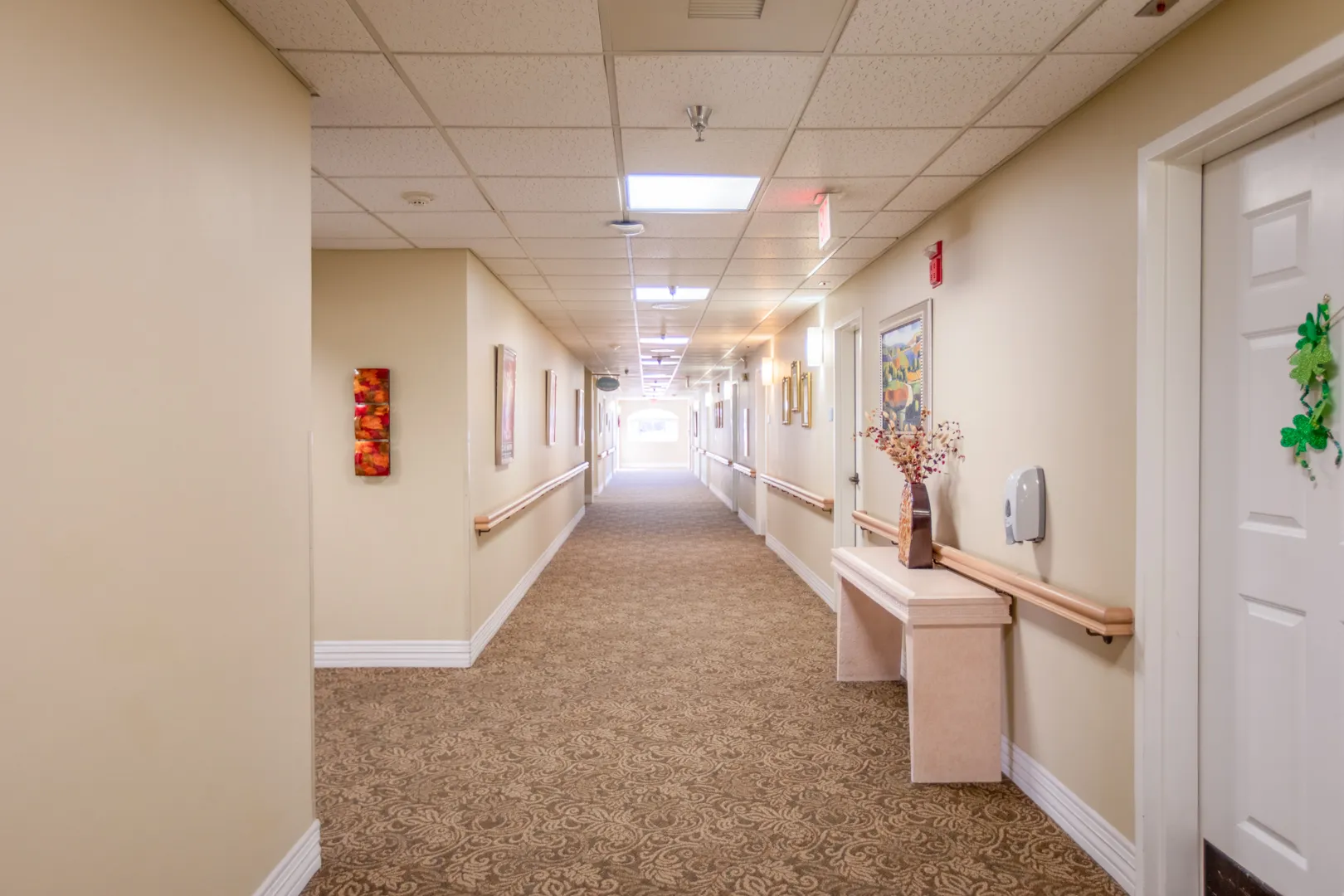 A well-lit hallway in the facility with decorations