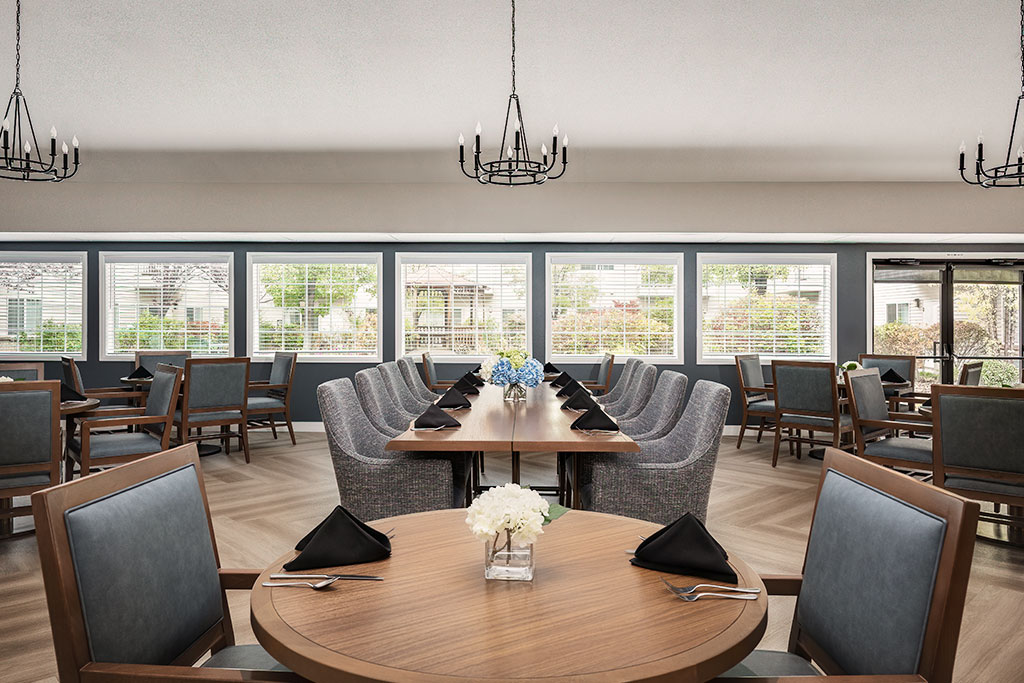 Elegant dining room with tables set for a meal