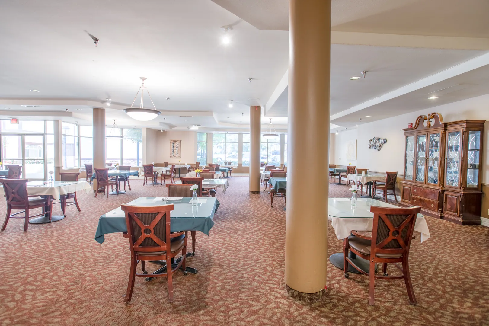 Dining area in an assisted living facility with empty tables