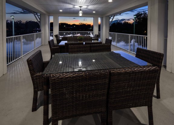 Outdoor seating area with a view at sunset