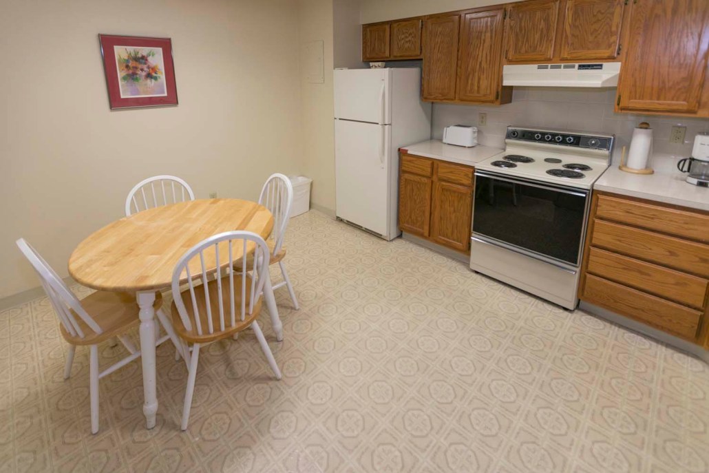 Clean kitchen area with dining table