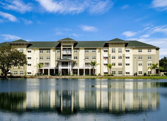 Exterior view of the Arbor Hills facility by the lake