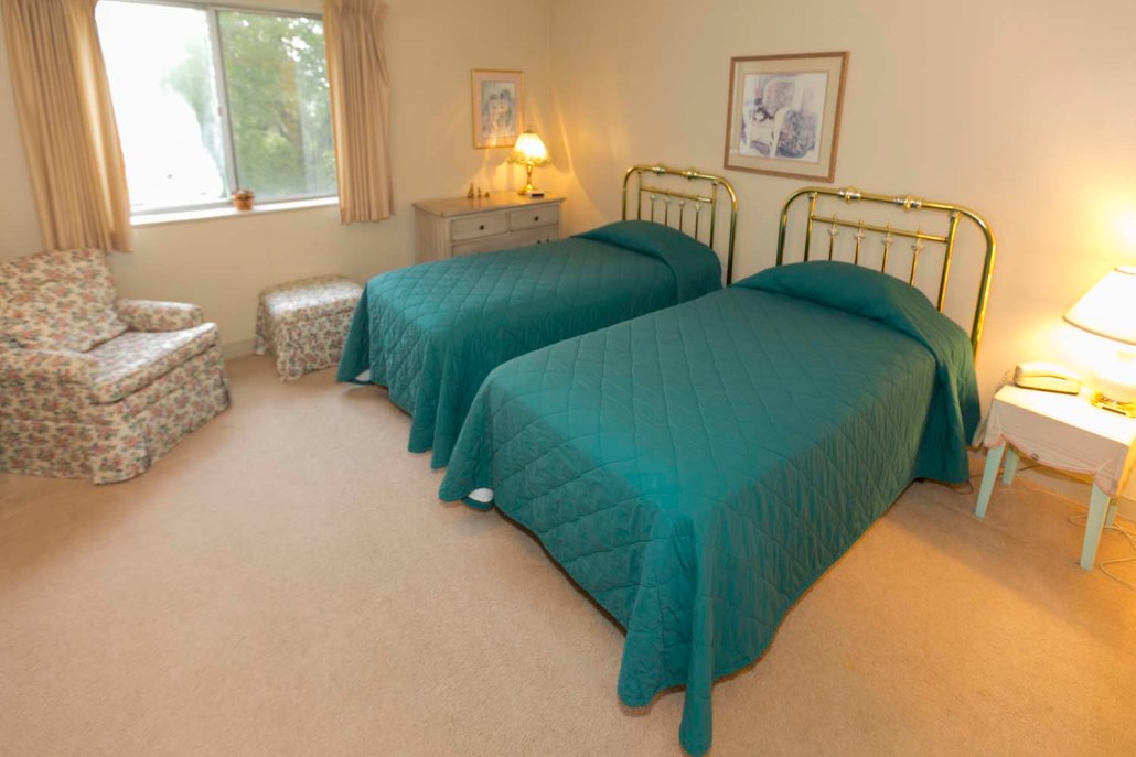 Cozy twin bedroom in an assisted living facility