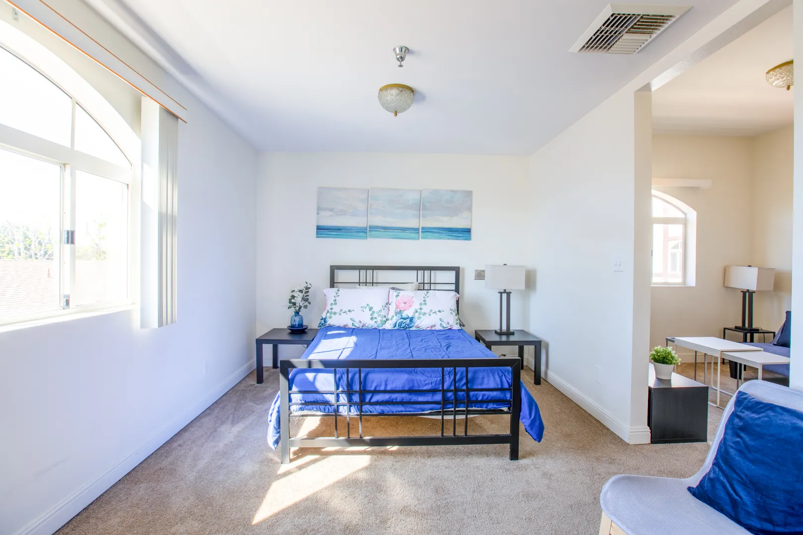Brightly lit resident room with a bed and decor