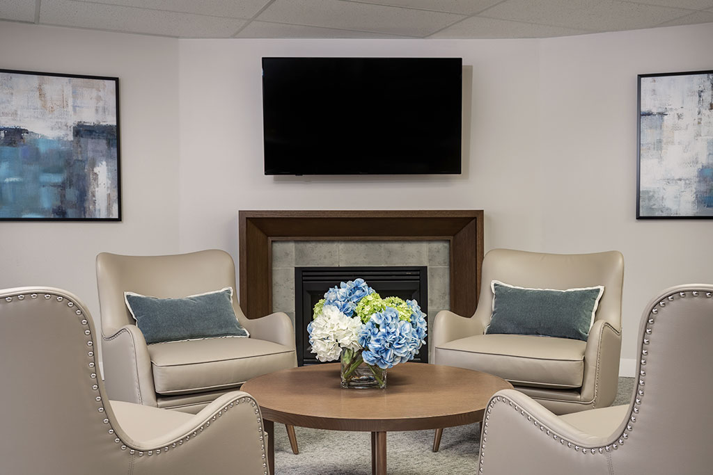 Cozy common area with comfortable seating and floral centerpiece