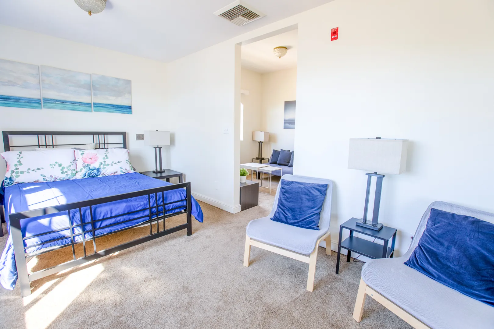 Brightly lit resident room with furnishings