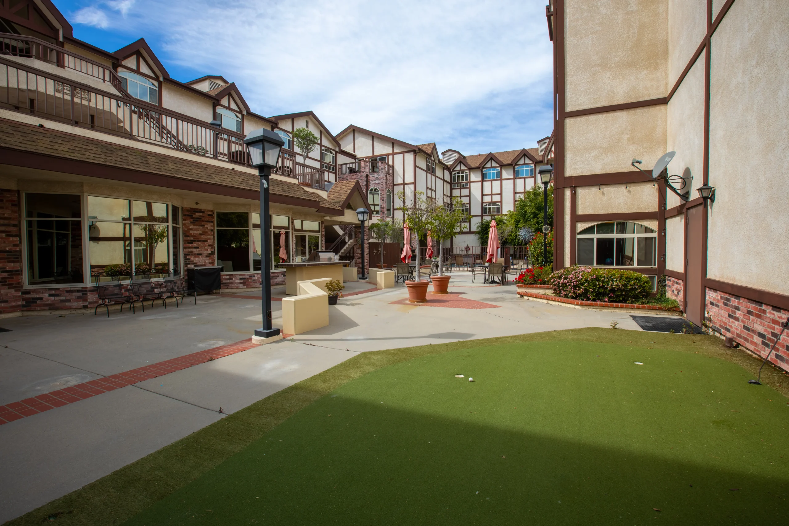 Outdoor courtyard area with seating and landscaping