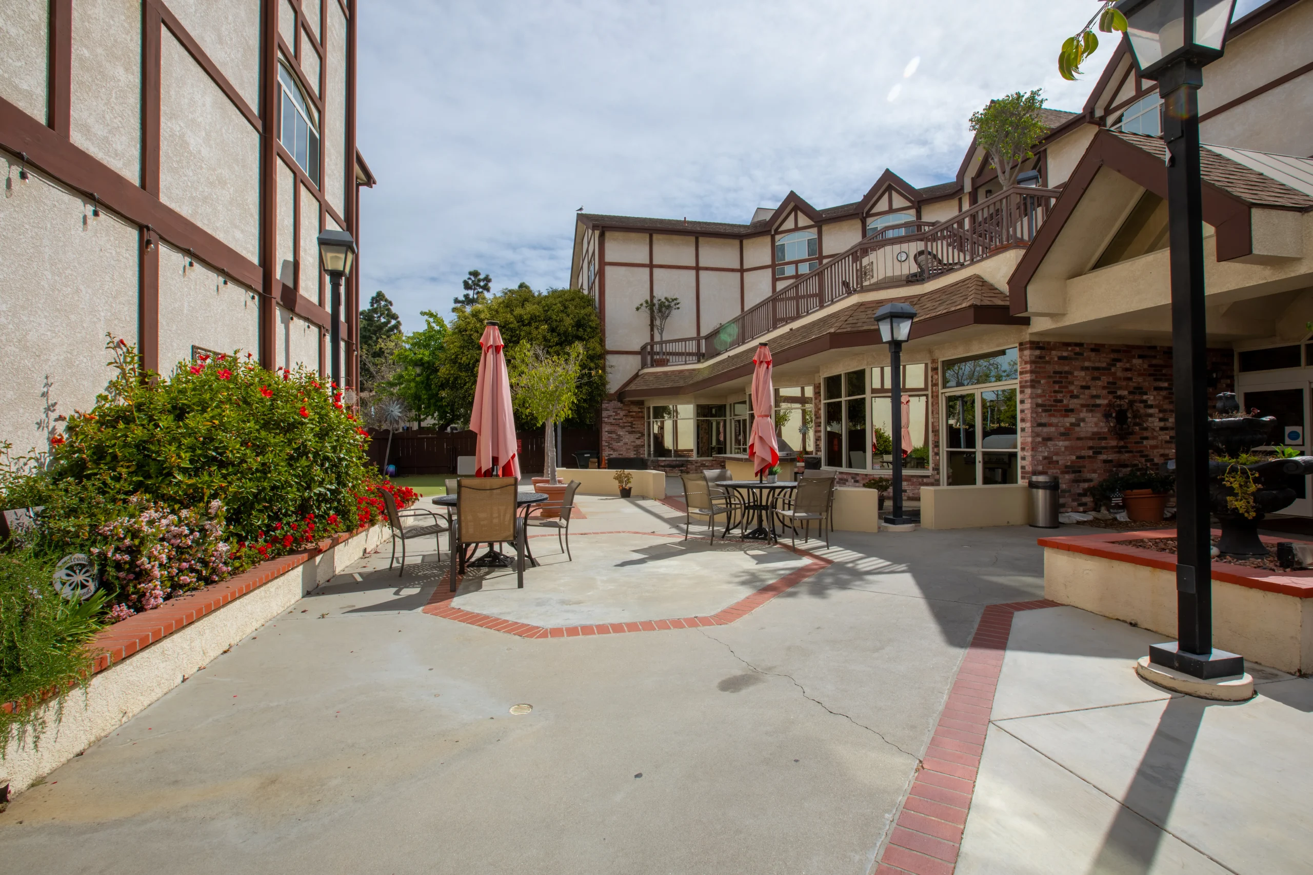 Outdoor patio area with seating and umbrellas
