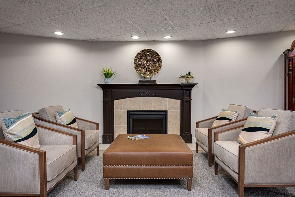 Cozy sitting area with comfortable chairs and fireplace