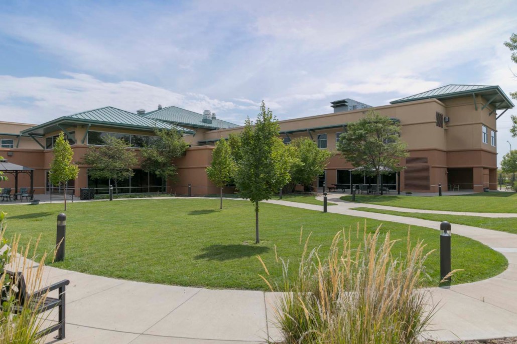 Exterior view of the facility with landscaped grounds