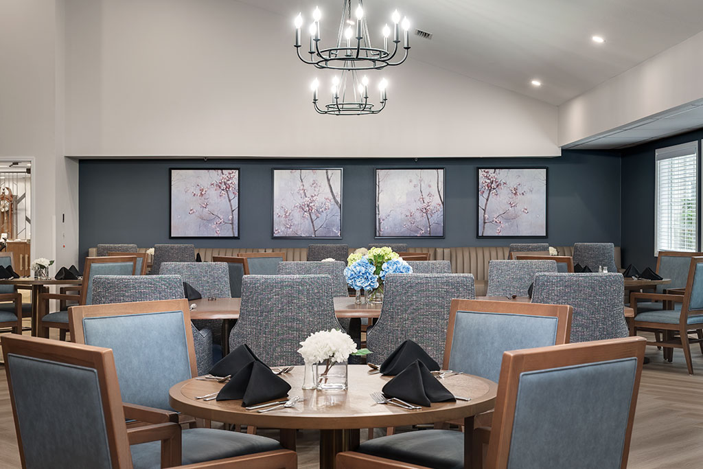 Modern dining room setup with floral decor