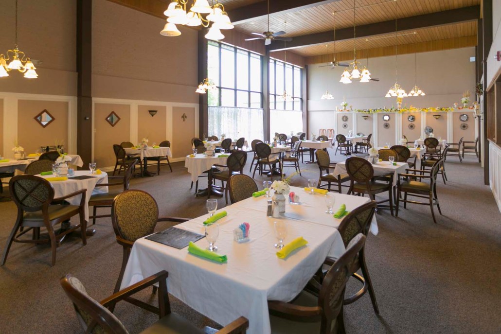 Bright, spacious dining area with table settings