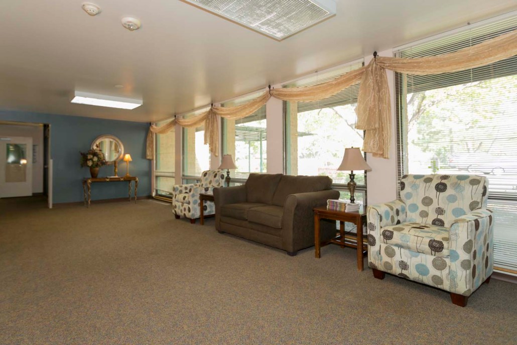 Interior lounge area with seating and windows