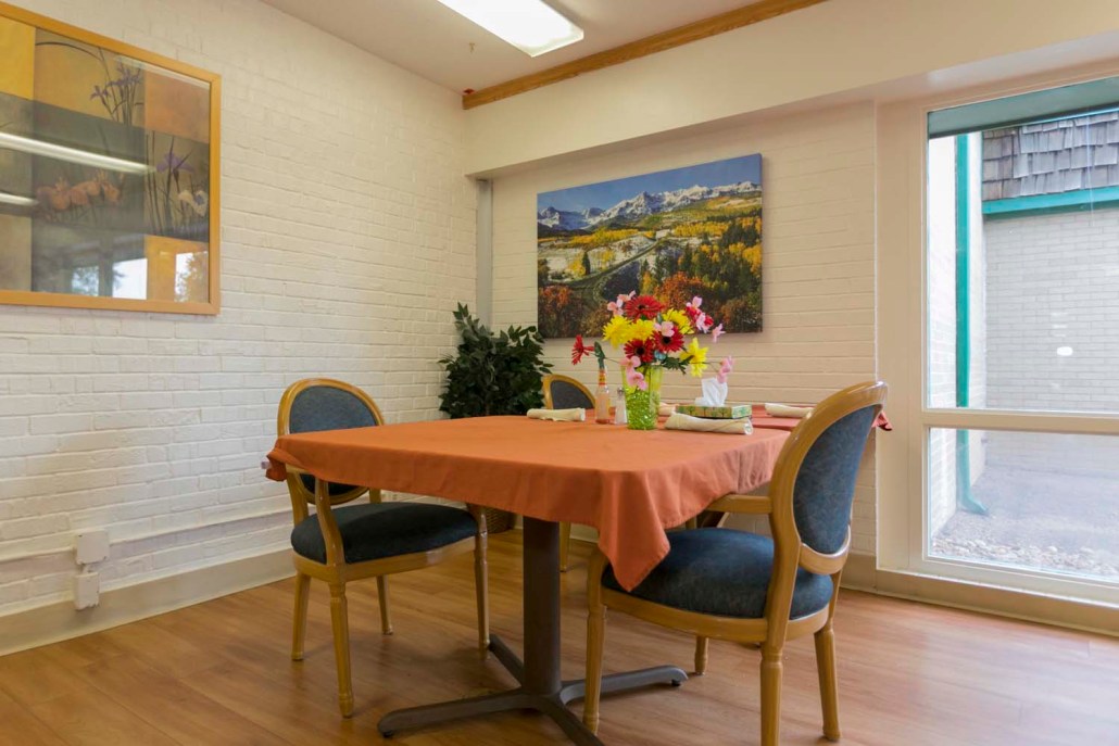 Cozy common area with a table and flowers