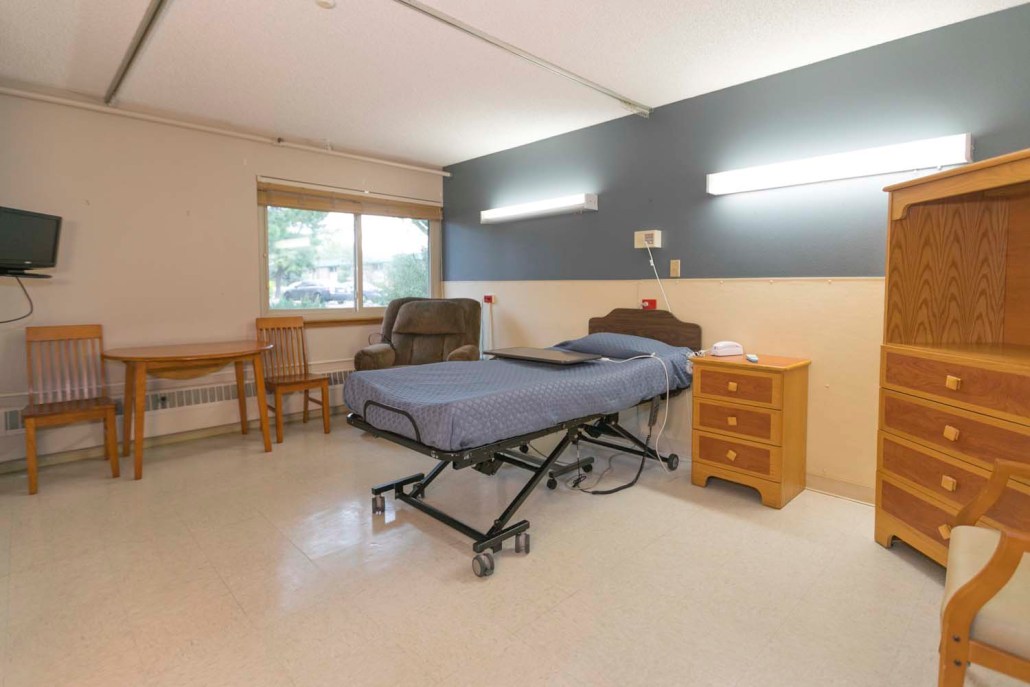 A resident room with bed and furniture