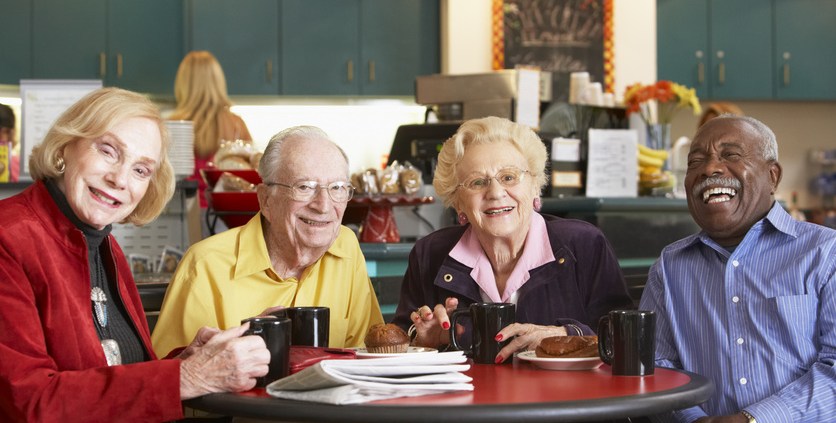 Residents enjoying coffee and pastries in a common area