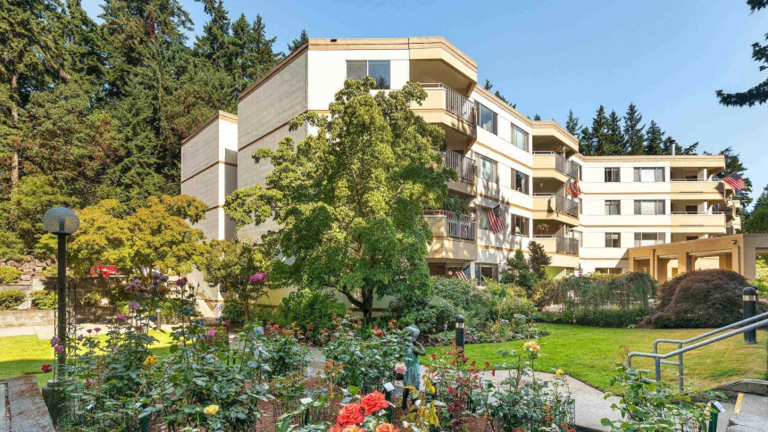 Exterior view of the facility surrounded by gardens
