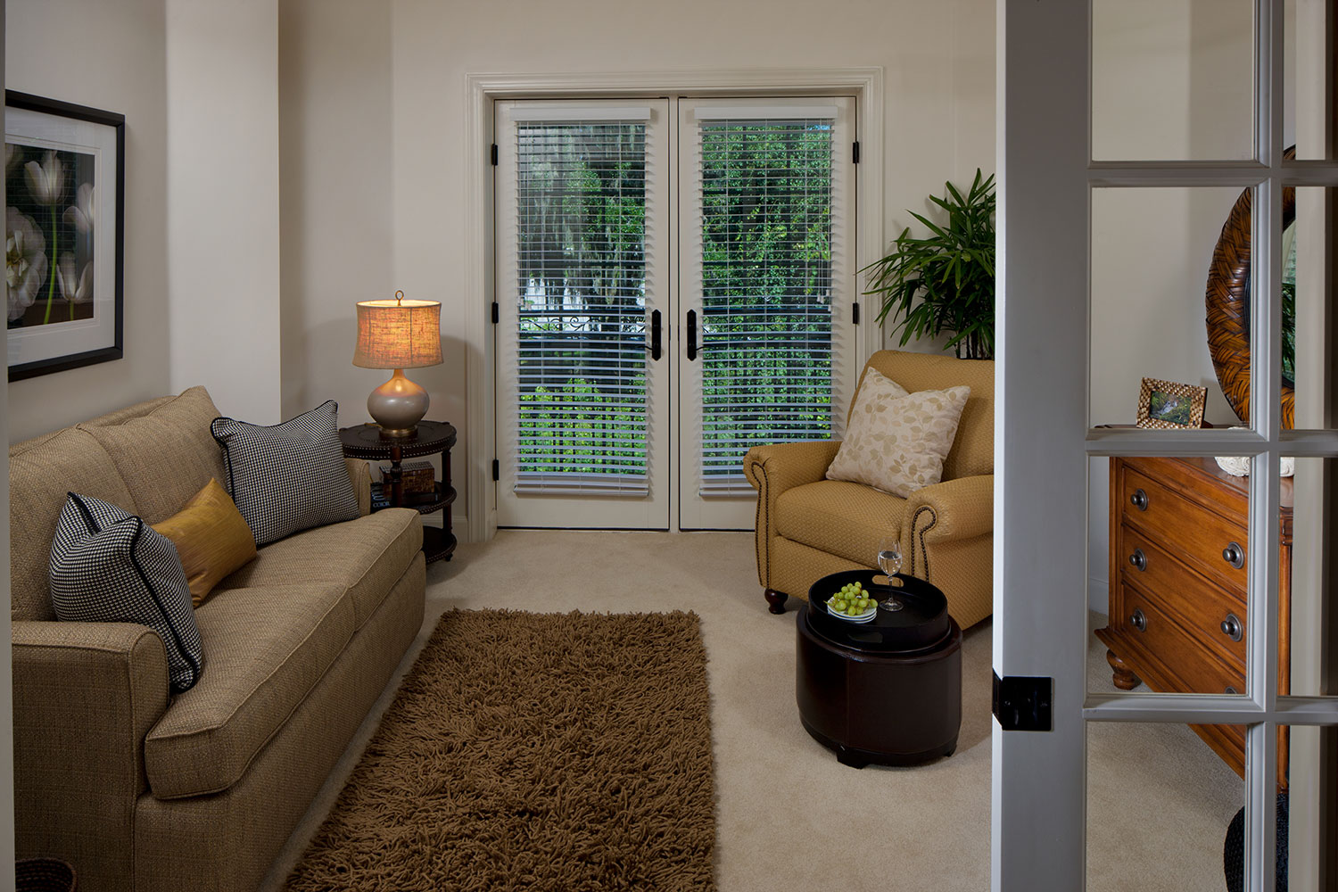 Cozy living area in a resident room with natural light
