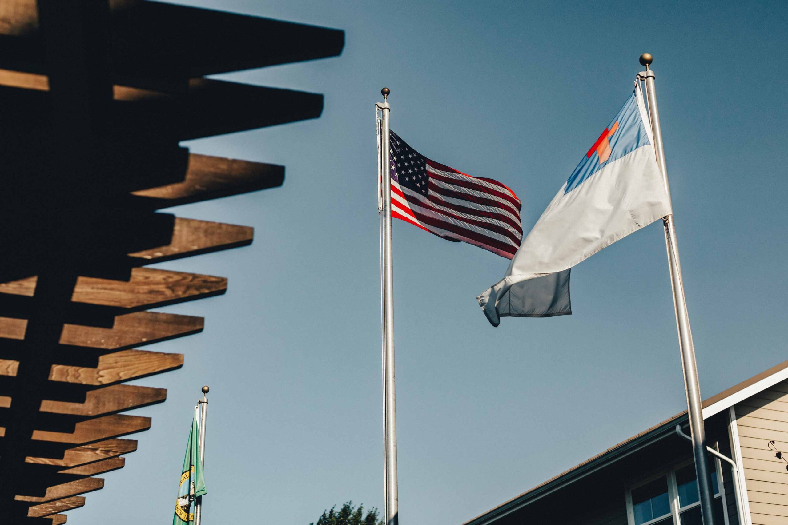 Flags flying in front of a senior living facility