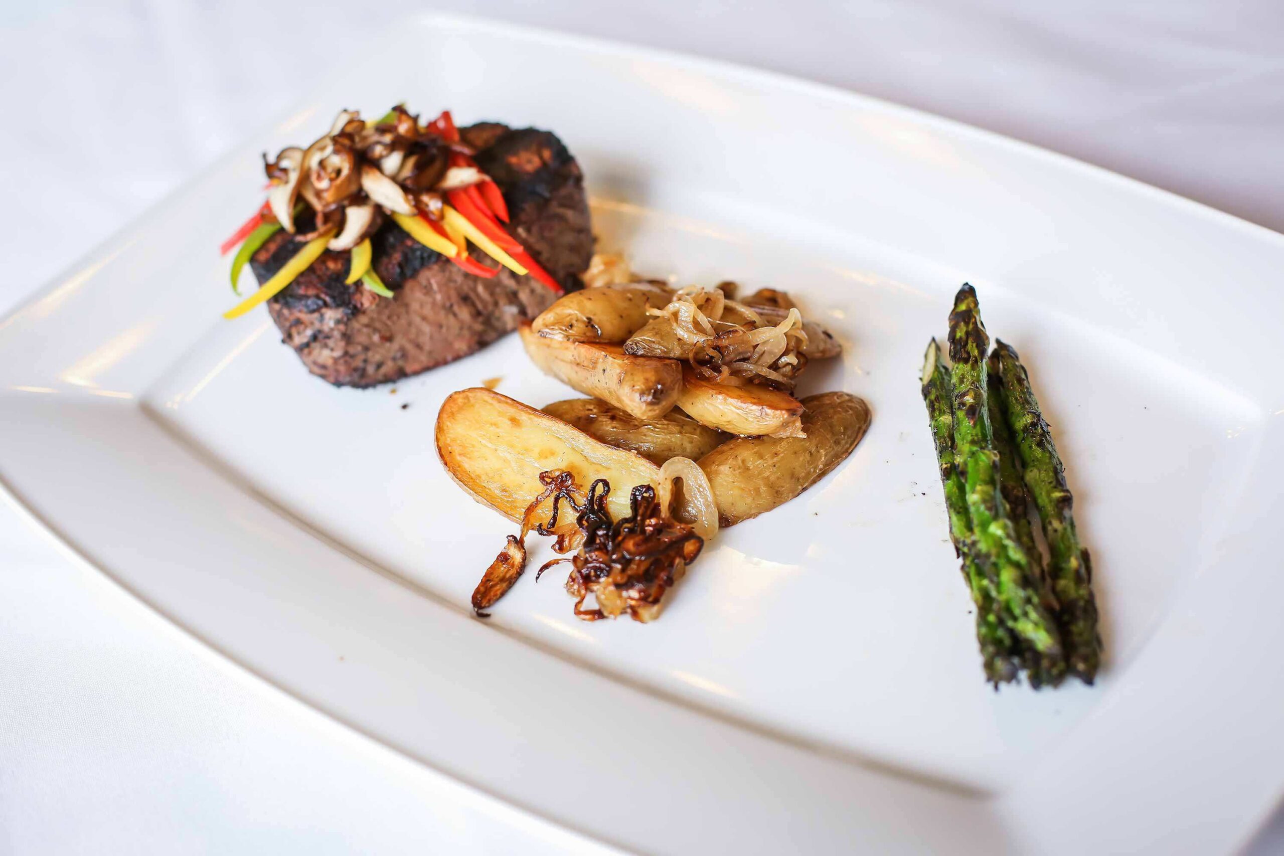 Gourmet meal plated with vegetables and meat
