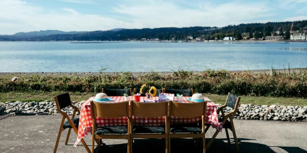 Outdoor dining setup by the water