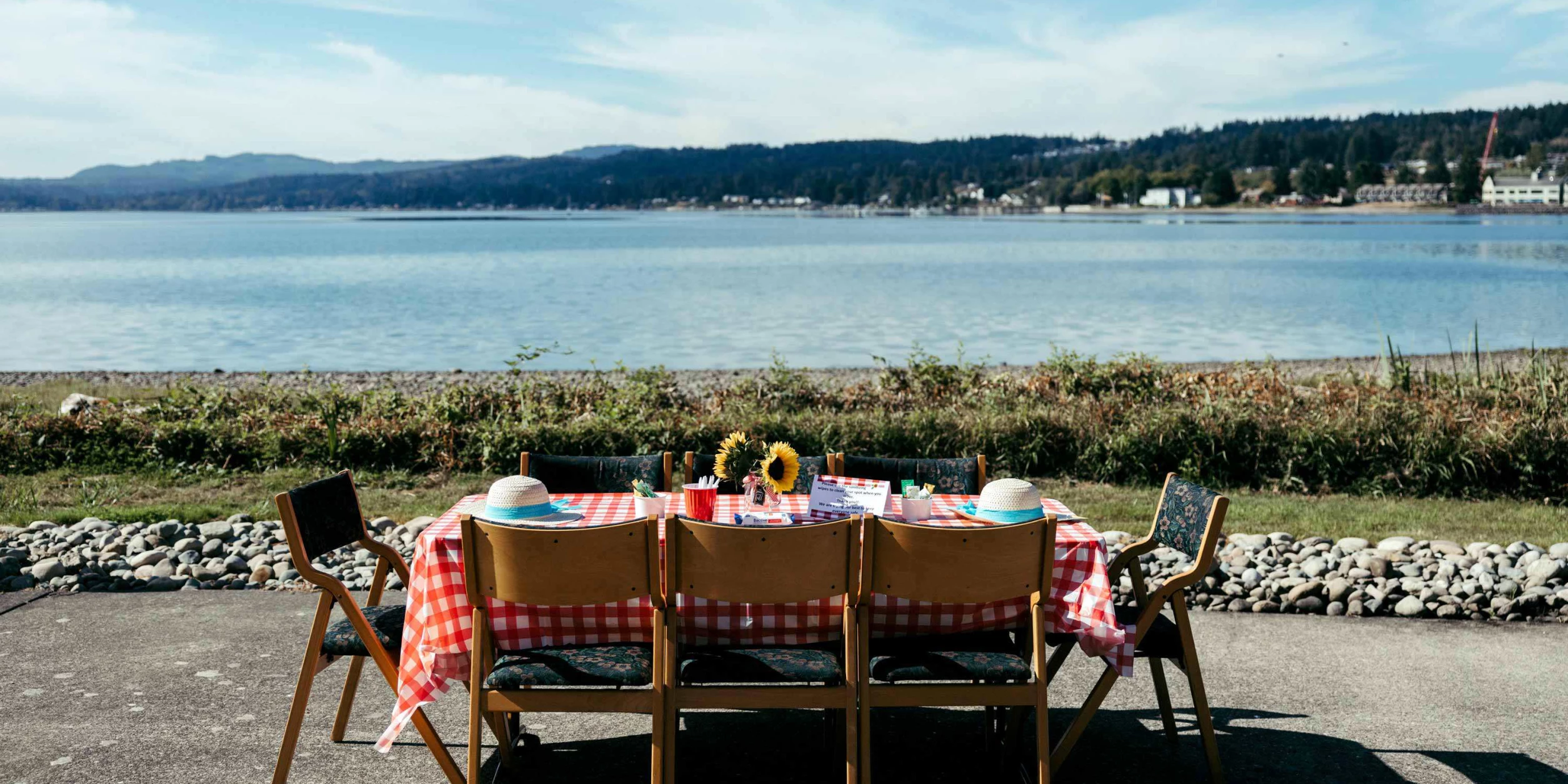 Outdoor dining setup with a view of the water