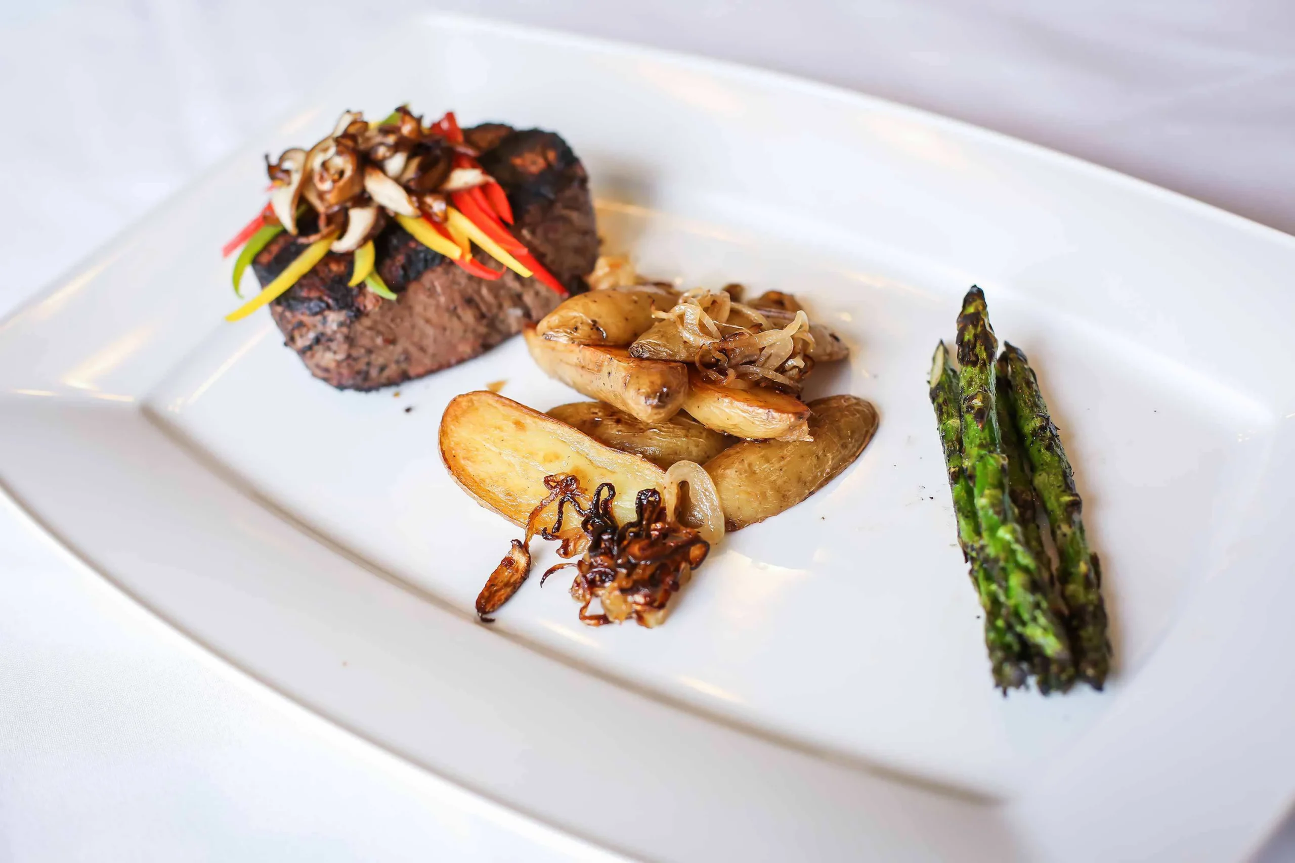 Gourmet meal plated beautifully with vegetables