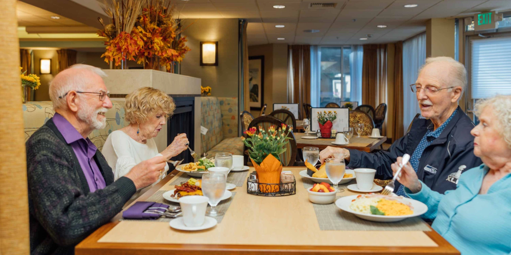 Residents enjoying a meal together in the dining room