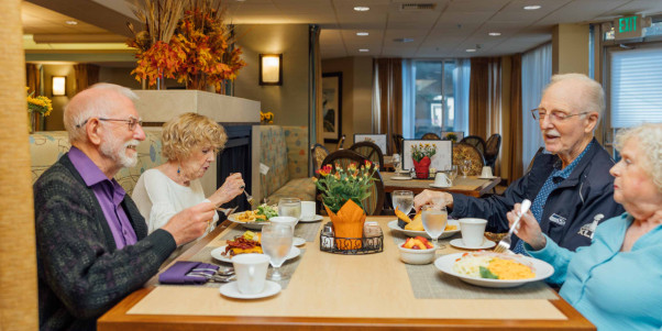 Residents enjoying a meal in the dining room