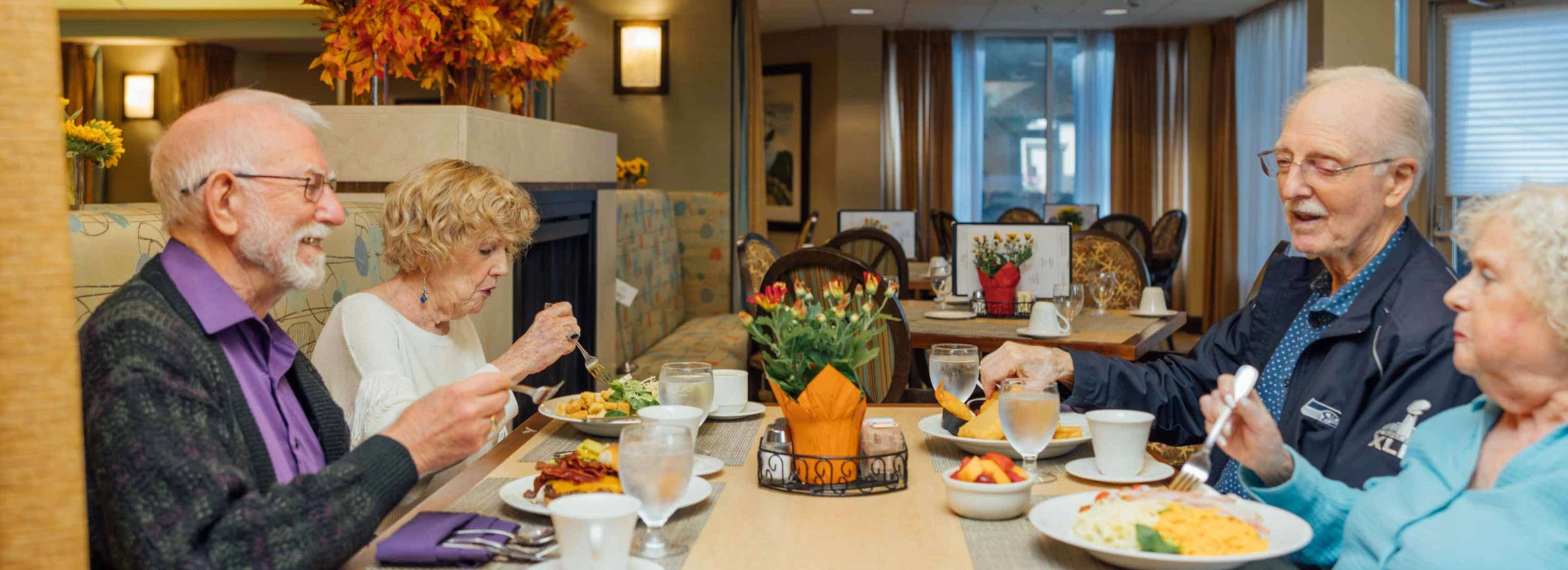 Residents enjoying a meal in the dining room