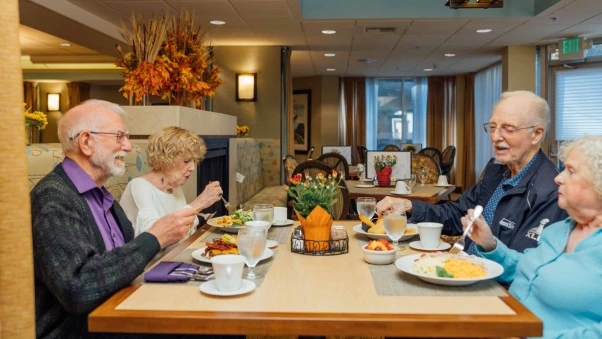 Residents enjoying a meal in the dining room