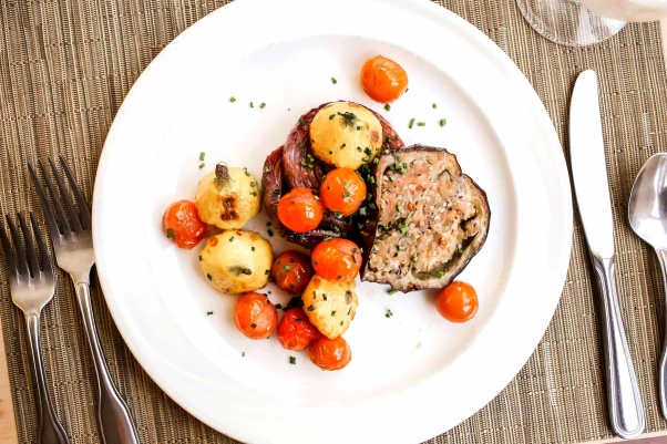 A plated meal with meatballs and potatoes