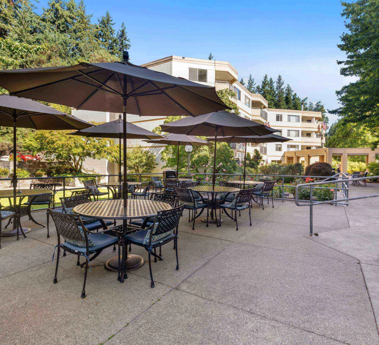 Outdoor dining area with tables and umbrellas
