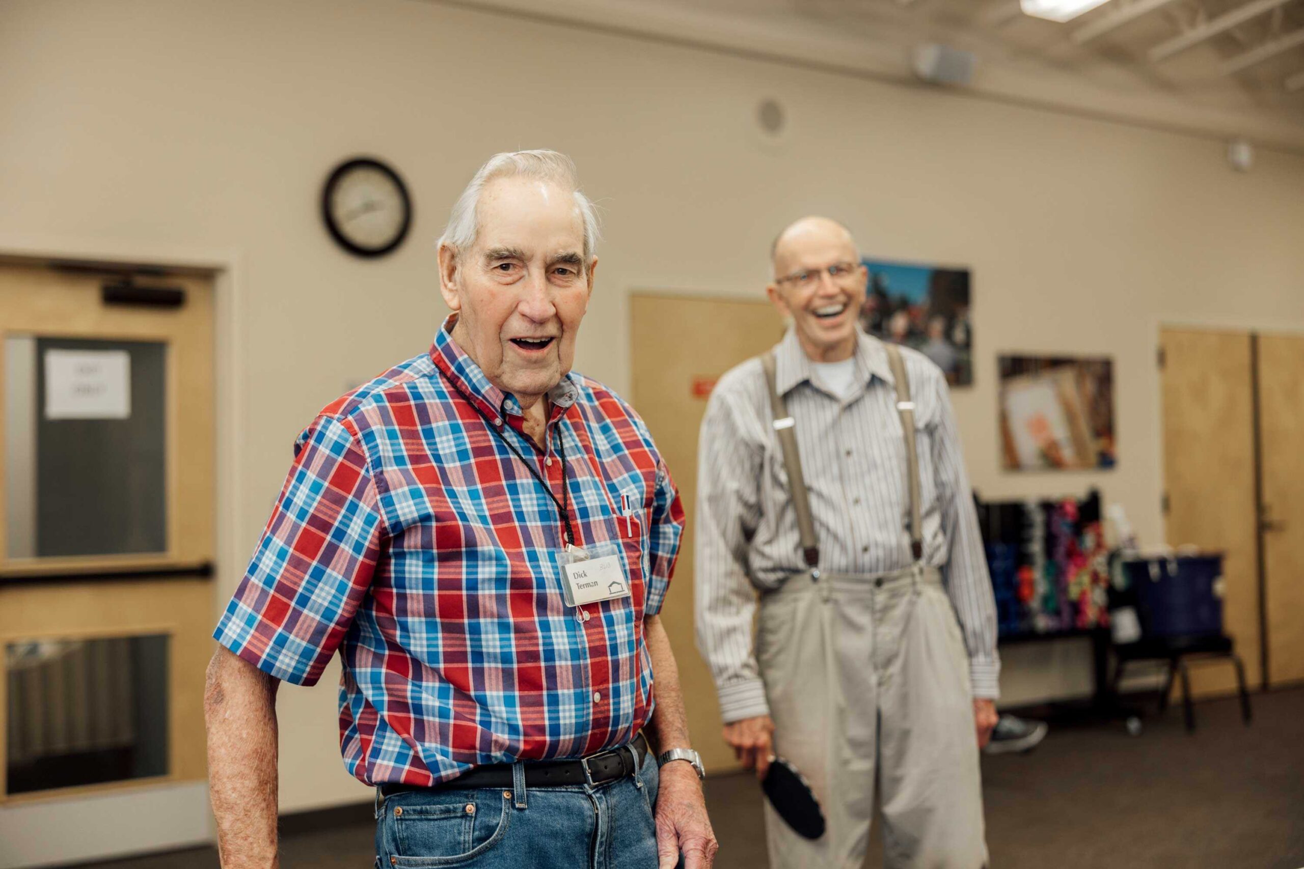 Two residents smiling in a common area