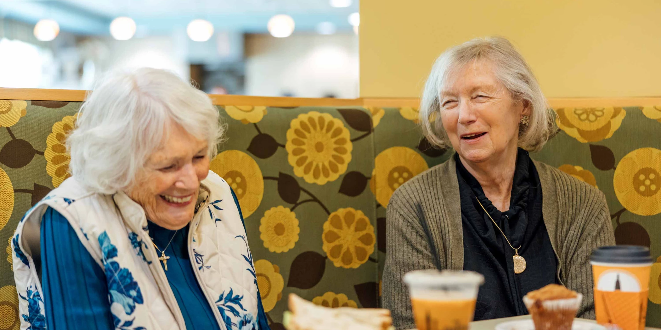 Two happy residents enjoying coffee together