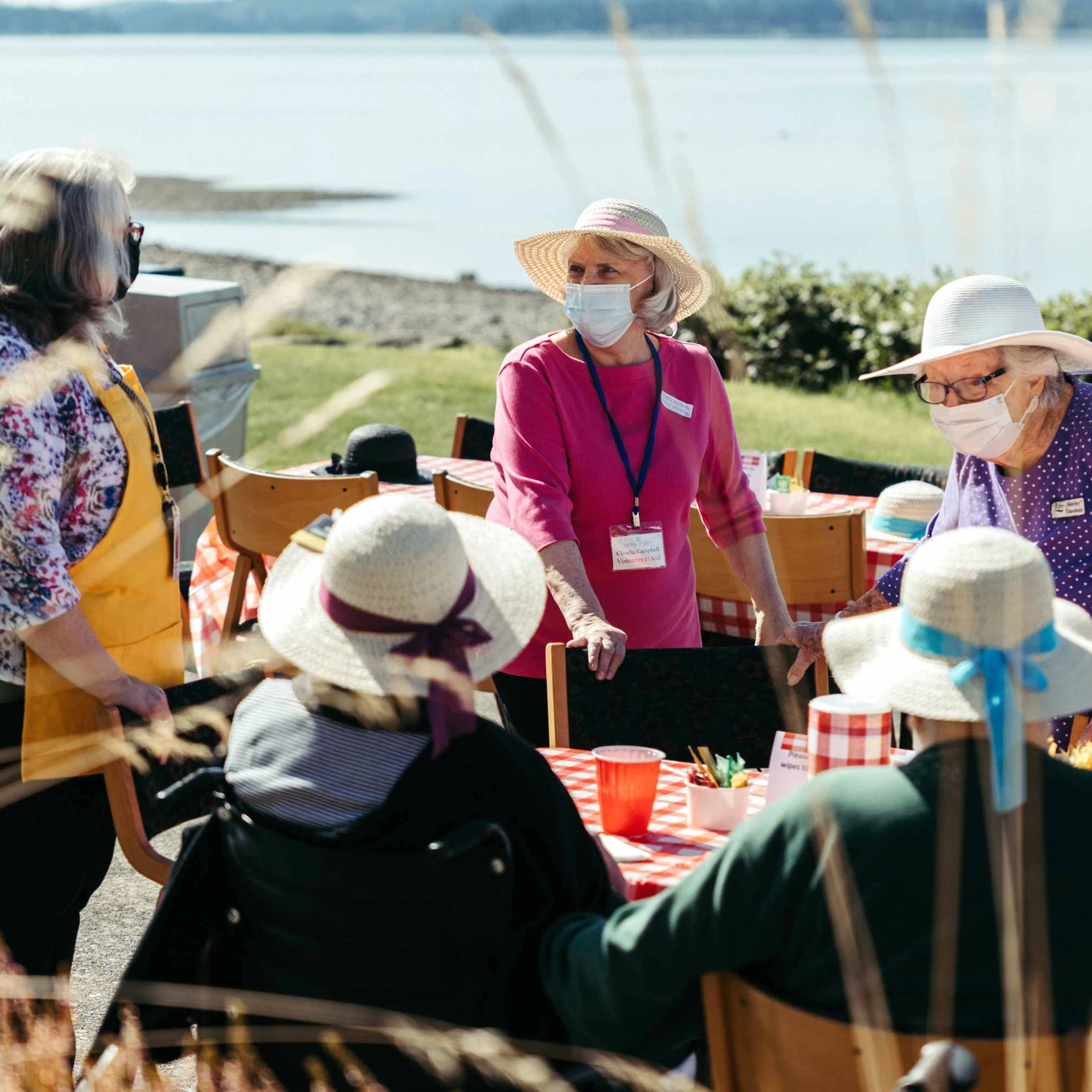 Residents enjoying an outdoor gathering by the water