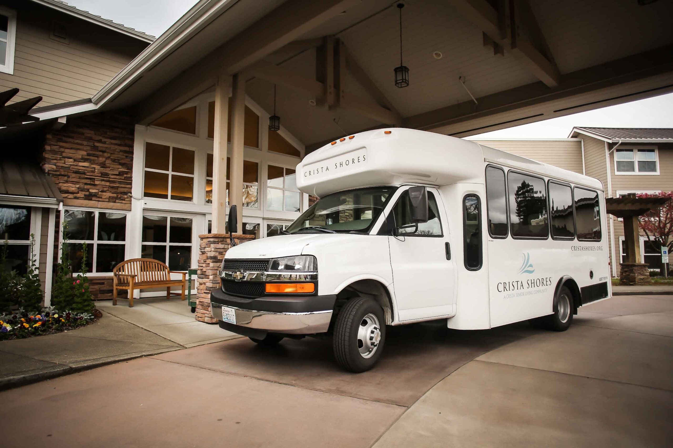 Facility shuttle van parked in front of the building