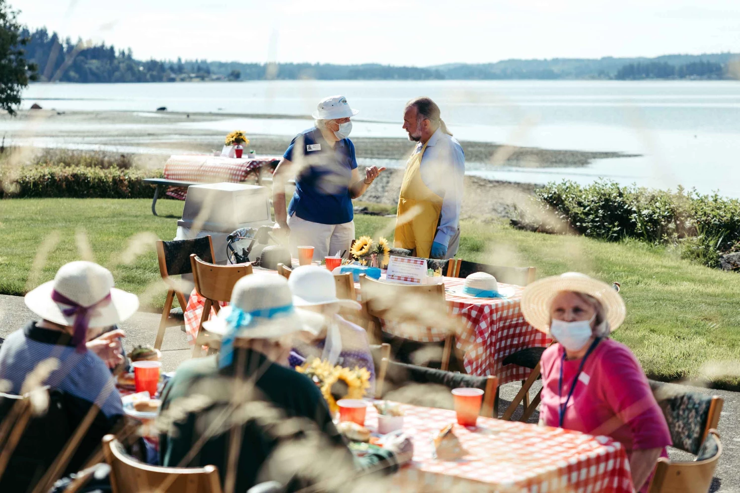 Residents enjoying an outdoor gathering by the water