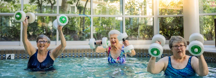 Residents exercising in a therapy pool