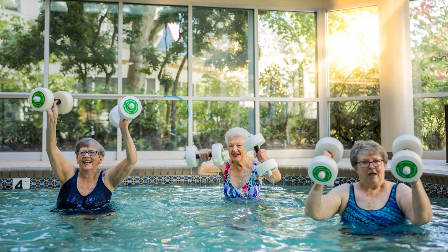 Residents exercising in a warm water pool