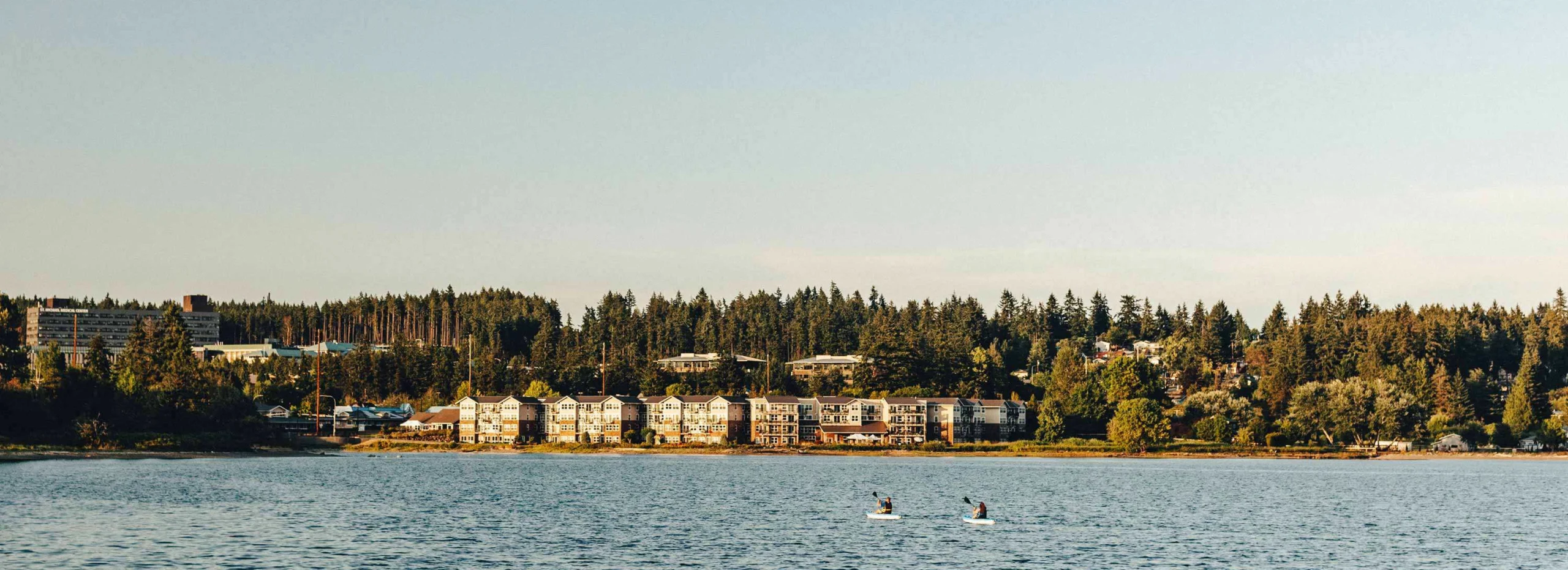 Waterfront view of Cristwood assisted living facility in nature