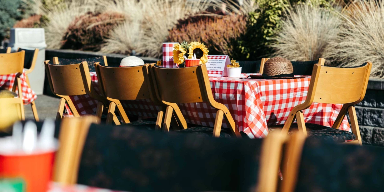 Outdoor dining setup with checkered tablecloths