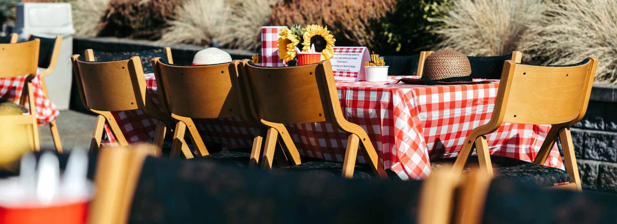 Outdoor dining setup with a checkered tablecloth