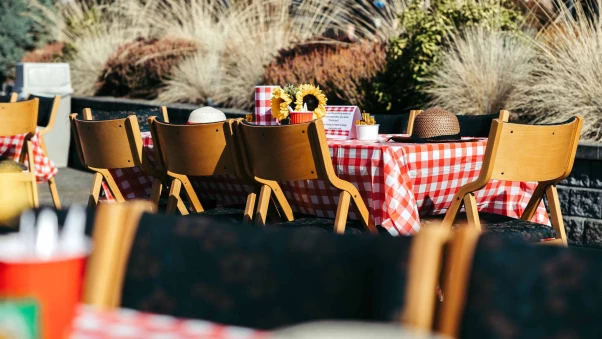 Outdoor dining setup with checkered tablecloths